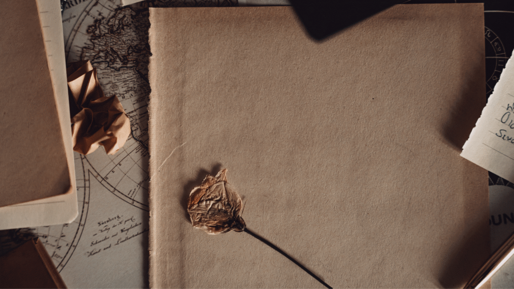 A notebook with a flower on it.